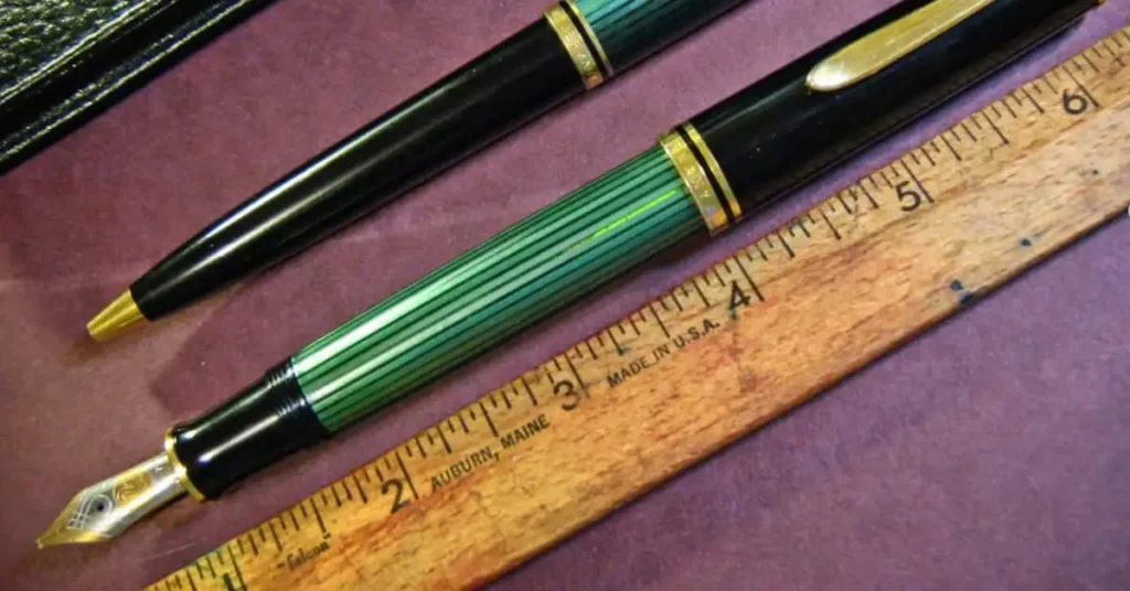wodden ruler and grren pen
