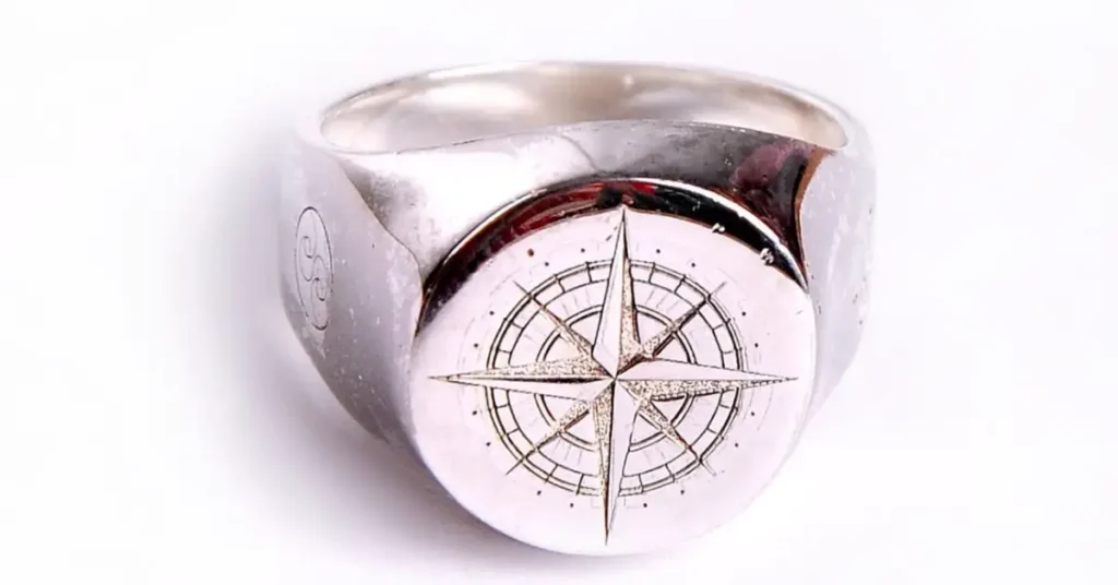 silver compass themed ring
