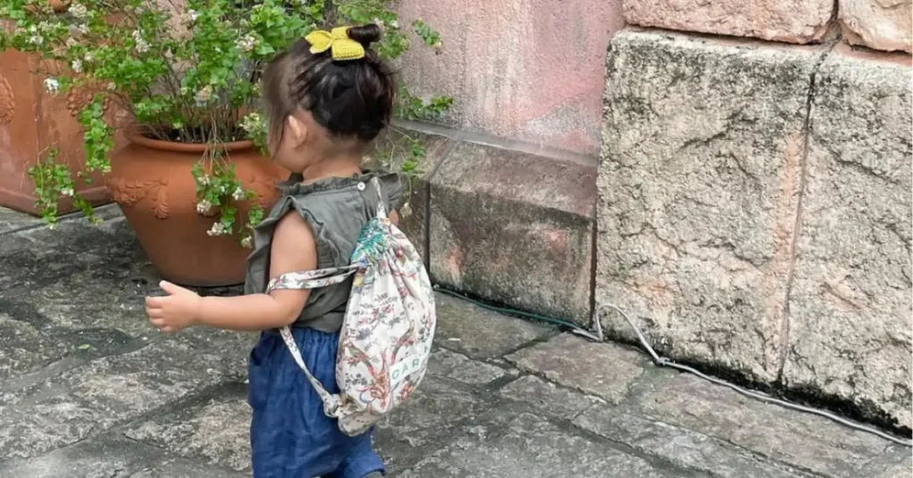 young child with backpack
