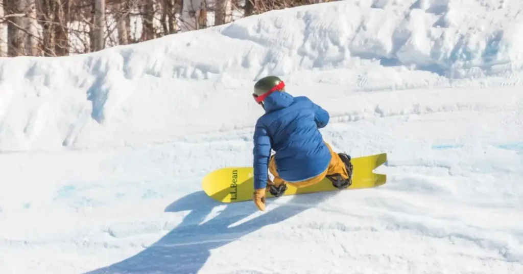 man with yellow snowboard
