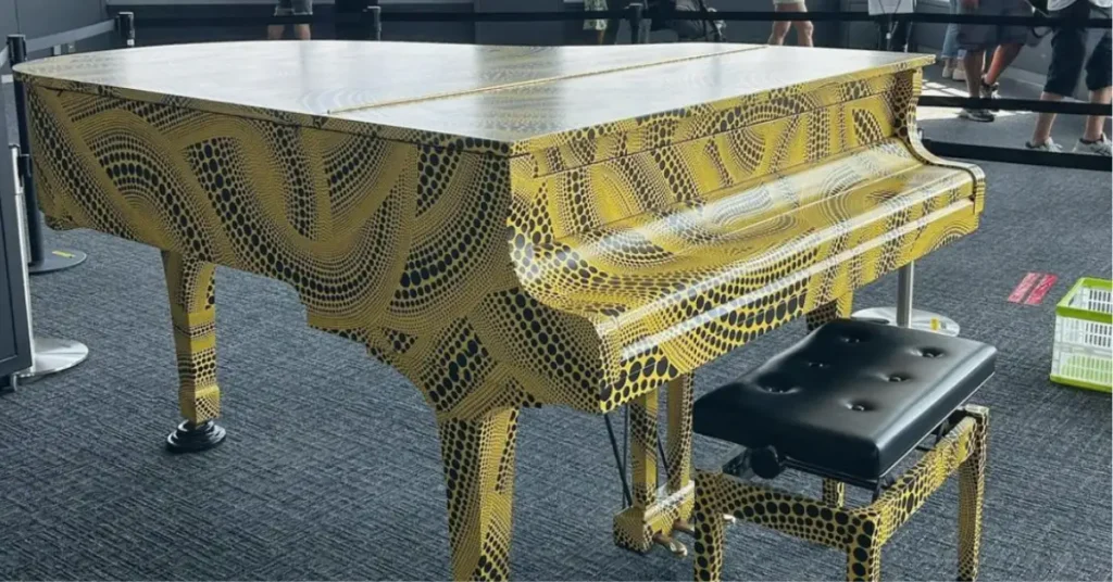 yellow piano with black dots