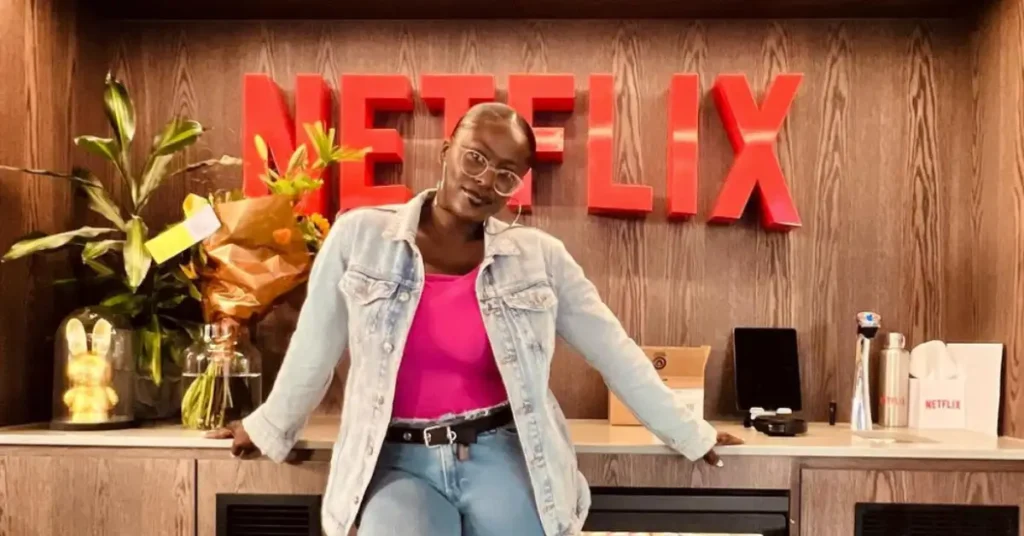 woman standing in front of a netflix sign