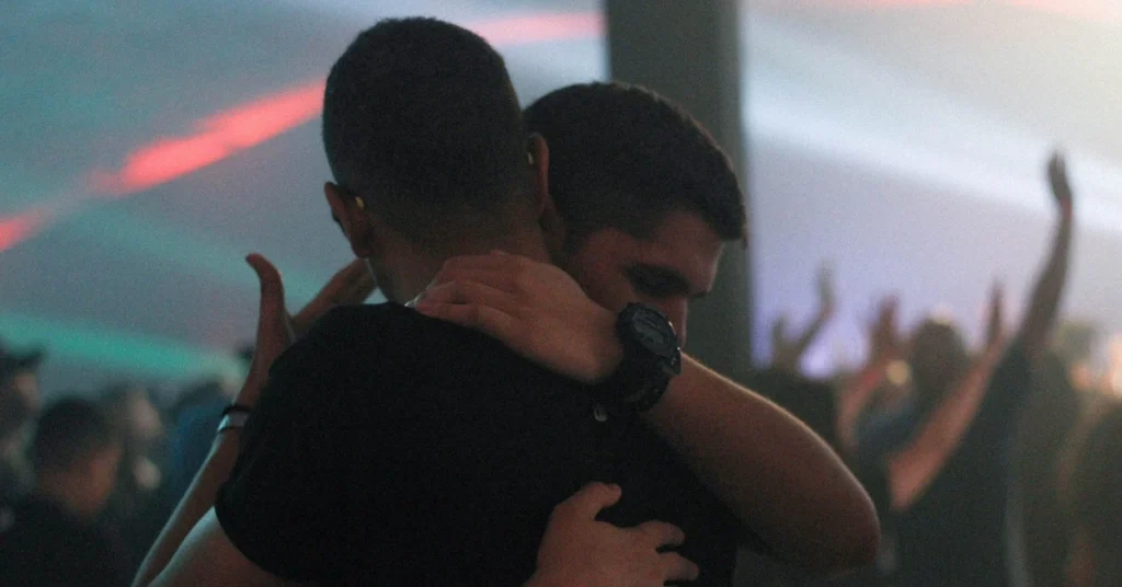 two gay men hugging each other
