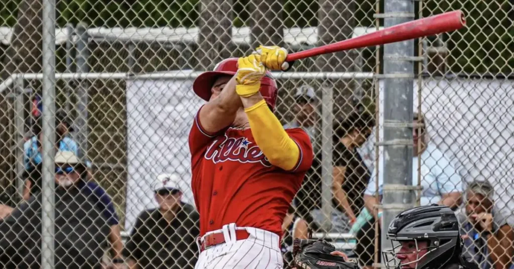 male softball player with a bat