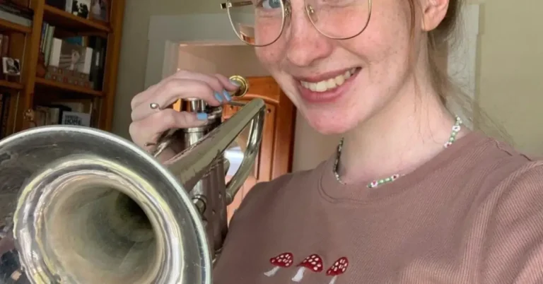 young woman with silver trumpet