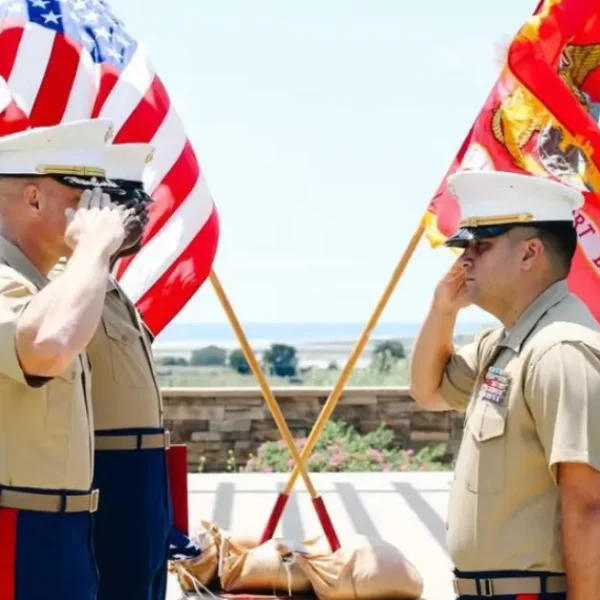 three marines saluting