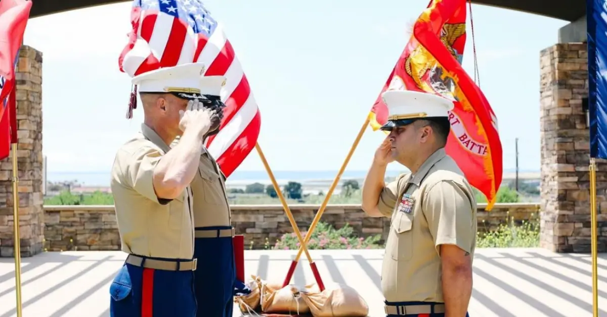 three marines saluting