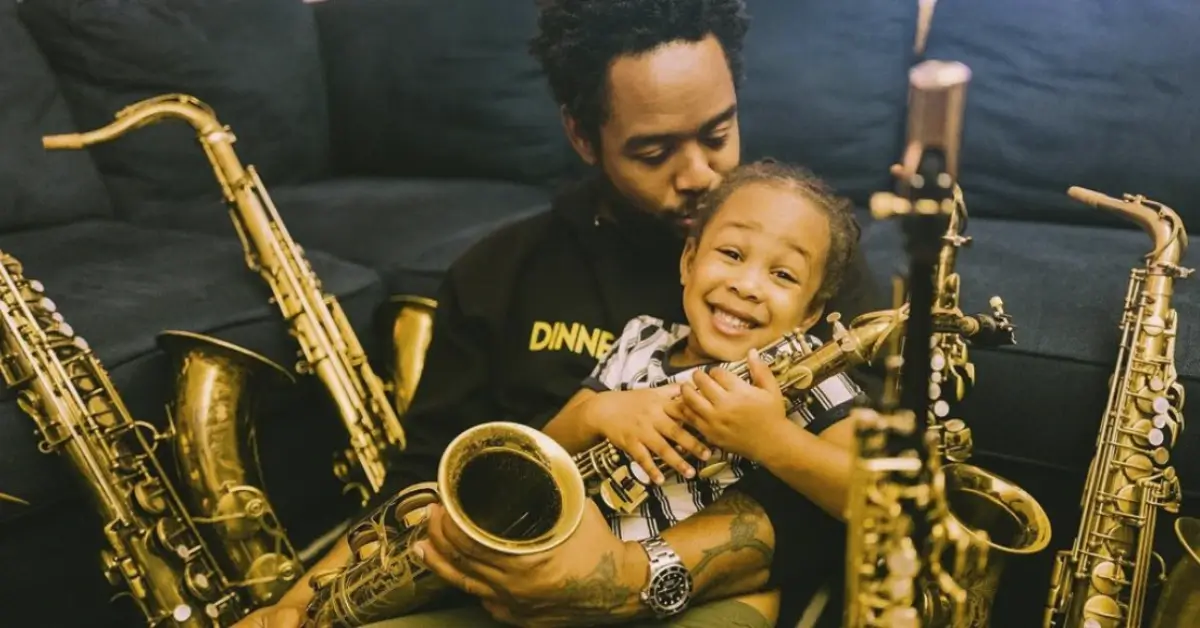 young father with his son and many saxophones
