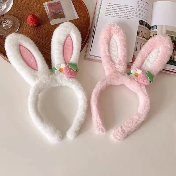 Easter Hats in pink and white next to a book on a table