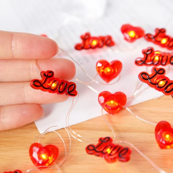 Valentines Office Decorations as fairy lights in hands