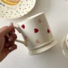 Valentines Day Coffee Mugs held in hand