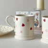 Valentines Day Coffee Mugs in front of a candle