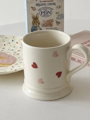 Valentines Day Coffee Mugs next to books