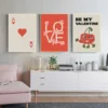 Valentines Day Wall Decor in various styles above a chair and white shelf
